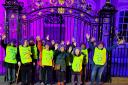 A flash mob of supporters donned purple wigs outside of the Guildhall