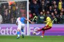 Edo Kayembe strokes home the winning penalty.