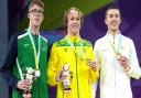 Daniel Wiffen (silver), Sam Short (gold) and Luke Turley (bronze) on the podium after the men's 1500m freestyle final