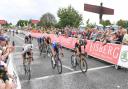 Wout van Aert (right) beats Julian Alaphilippe (left) and Ethan Hayter (centre) under the gaze of the Angel of the North in Gateshead.