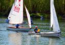 Charles Adams passes Tony Hale after his capsize. Picture: VAL NEWTON