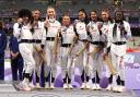 Jodie Williams and Team GB show off their 4x400m relay bronze medals. Picture: MARTIN RICKETT/PA