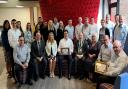 Mayor Cllr Frank Marsh with Matthew Cooper (seated centre) and staff at Woodhouse along with Donna Schultz, CEO of Herts Chamber and Perry Jackson, managing director of Oventrop UK Ltd, award sponsors