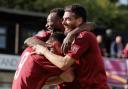 Brandon Adams is mobbed by Isaac Currie and Ronnie Henry after scoring the first for Potters Bar against Lewes. Picture: MANDY DAVIES