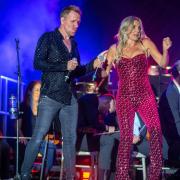 Jon Boydon and Jenna Lee-James on stage at the Queen Symphonic concert at Hatfield Park.