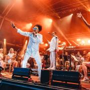 Vocalists on stage with the Urban Soul Orchestra at Classic Ibiza 2022 at Hatfield House.