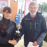 Annette Walter receives Welwyn Garden City Sailing Club's Commodore's Cup from Ian Stringer.