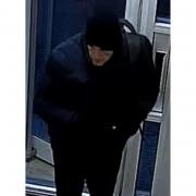 Herts police are searching for this man after a door was damaged in Welwyn Garden City.