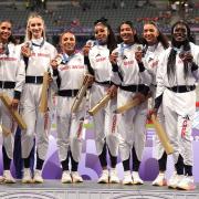 Jodie Williams and Team GB show off their 4x400m relay bronze medals. Picture: MARTIN RICKETT/PA