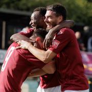 Brandon Adams is mobbed by Isaac Currie and Ronnie Henry after scoring the first for Potters Bar against Lewes. Picture: MANDY DAVIES