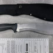 Police found the machete hidden in his waistband.