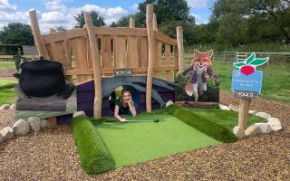 Willows staff member Charlotte does a final check of the Peter Rabbit Adventure Golf at Willows Activity Farm ahead of its opening day