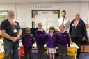 (L-R) Anthony Abery, WW1 Aviation Heritage Trust volunteer, Wimbish Primary Academy pupils, Chris Steadman, senior class teacher, and Cllr Stewart Luck