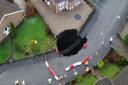 A massive sinkhole opened up on a residential street in Nant Morlais, Pant on Sunday (December 1).