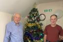 Len Bell (left) and Graeme Dargie with one of the donated trees