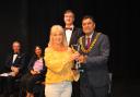 Rebekah Fortune of TACT receiving the Welwyn Cup from new Welwyn Hatfield Mayor, Councillor Pankit Shah.