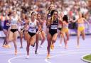 Jodie Williams takes hold of the baton in the 4x400m relay at the Paris Olympics. Picture: MARTIN RICKETT/PA