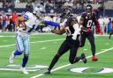 Dallas Cowboys wide receiver Jalen Tolbert, left, puts a stiff arm on Houston Texans safety Jimmie Ward (Gareth Patterson/AP)