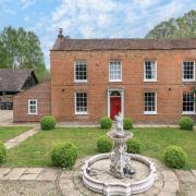 The detached Georgian residence offers versatile accommodation over two floors.