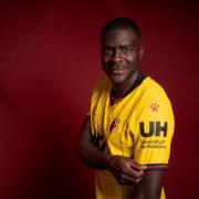 Ken Sema showcases the new University of Hertfordshire branded Watford FC shirt