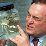 Deputy Prime Minister John Prescott takes a close look at a Chinese Mitten Crab called Dennis (Ben Curtis/PA)