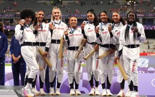 Jodie Williams and Team GB show off their 4x400m relay bronze medals. Picture: MARTIN RICKETT/PA